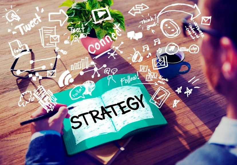 Confident business leader presenting strategy to a small team